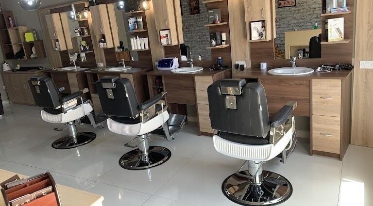 Modern barber chairs at Barber Tina at JJ's Barber Shop, Naxxar, MT for premium grooming services.