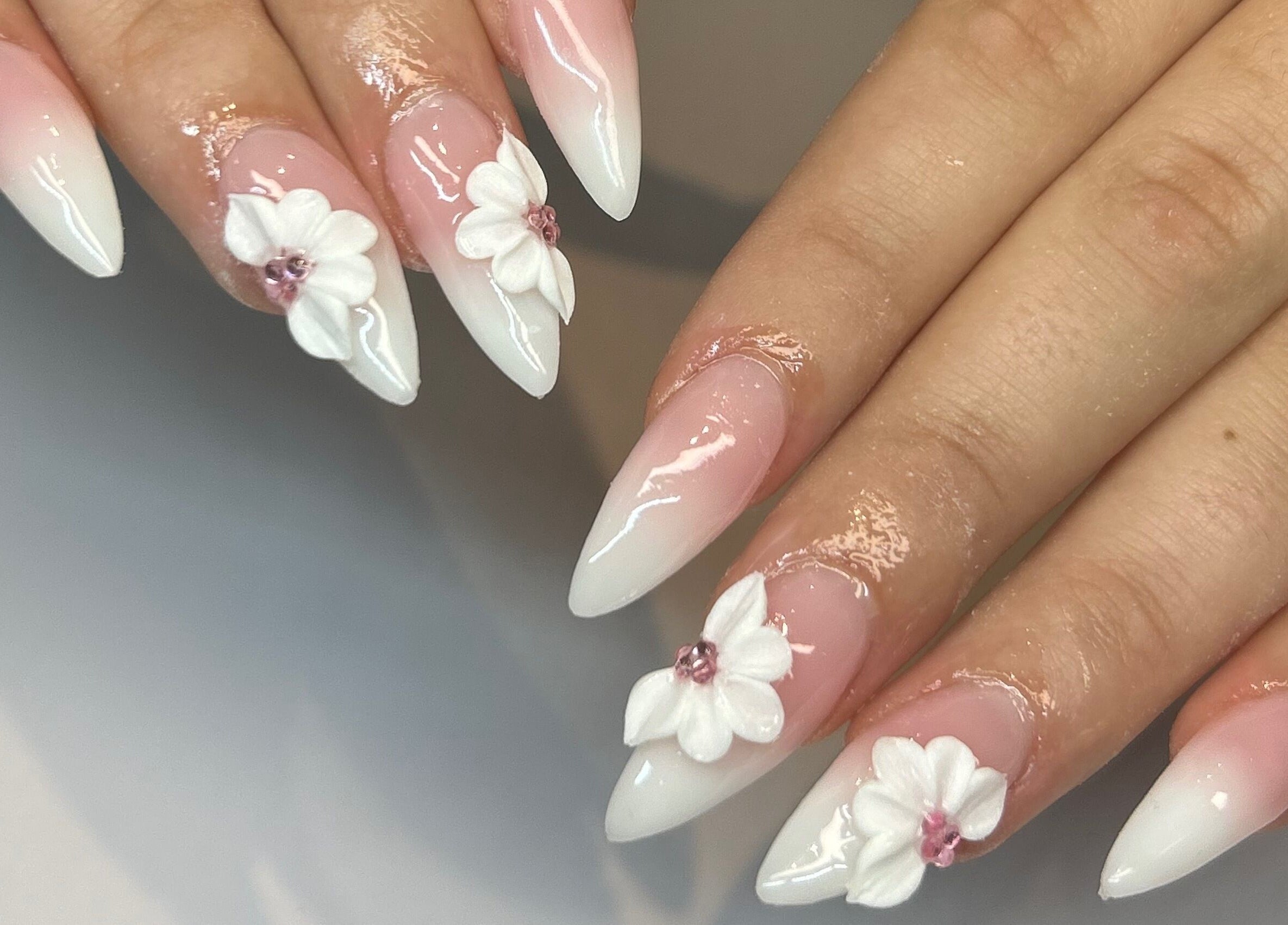 Elegant floral nail art at Polished By Jules in Caledon, Ontario, CA, showcasing exquisite design.