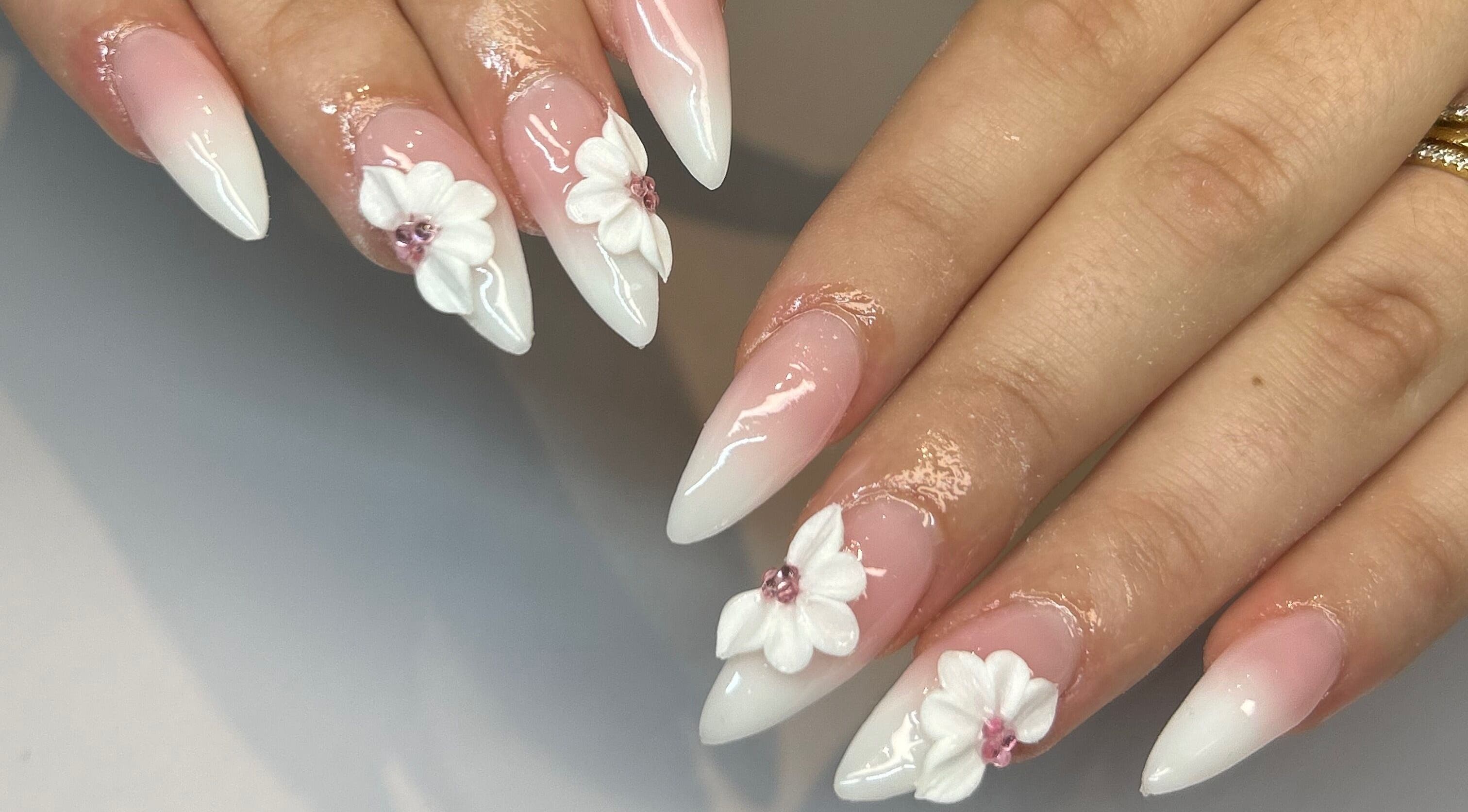 Elegant floral nail art at Polished By Jules in Caledon, Ontario, CA, showcasing exquisite design.