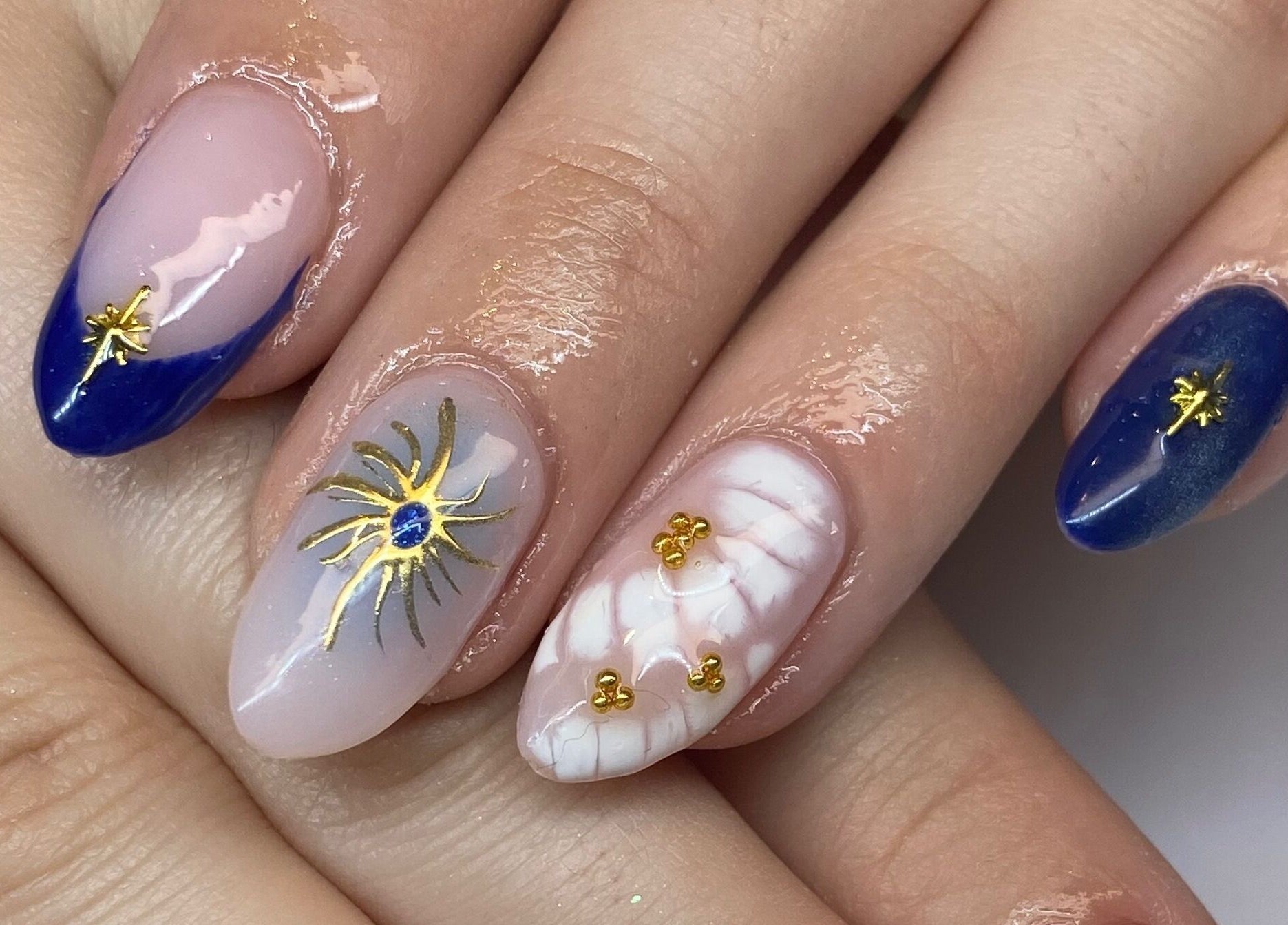 Elegant nail art with gold accents at Polished By Jules in Caledon, Ontario, CA.