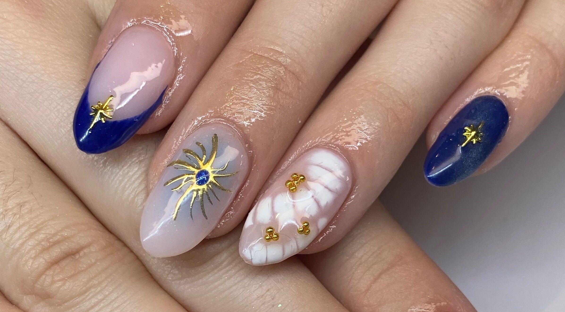 Elegant nail art with gold accents at Polished By Jules in Caledon, Ontario, CA.