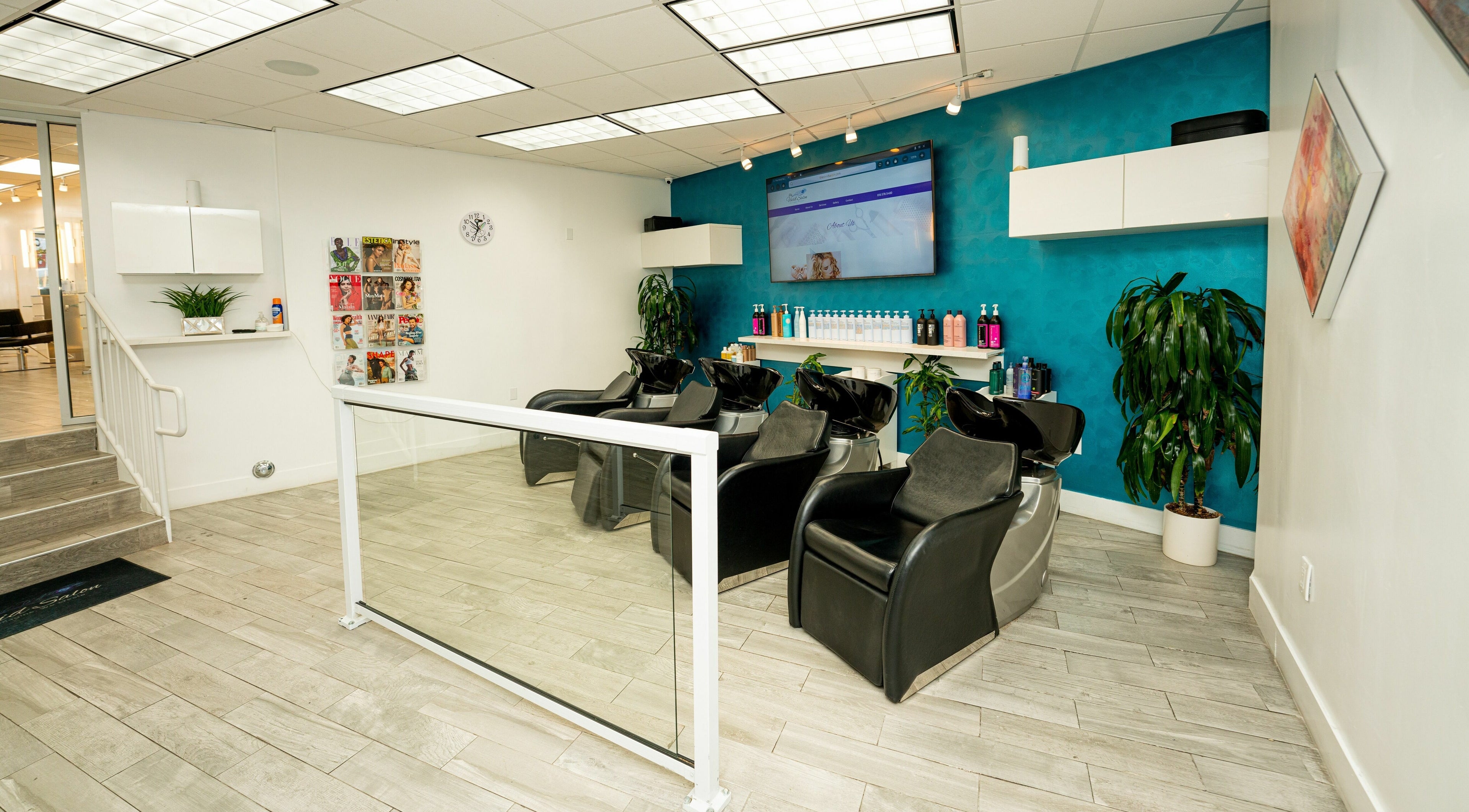 Sophisticated seating area at John Hairstylist in Los Angeles, California, US with sleek wash stations.
