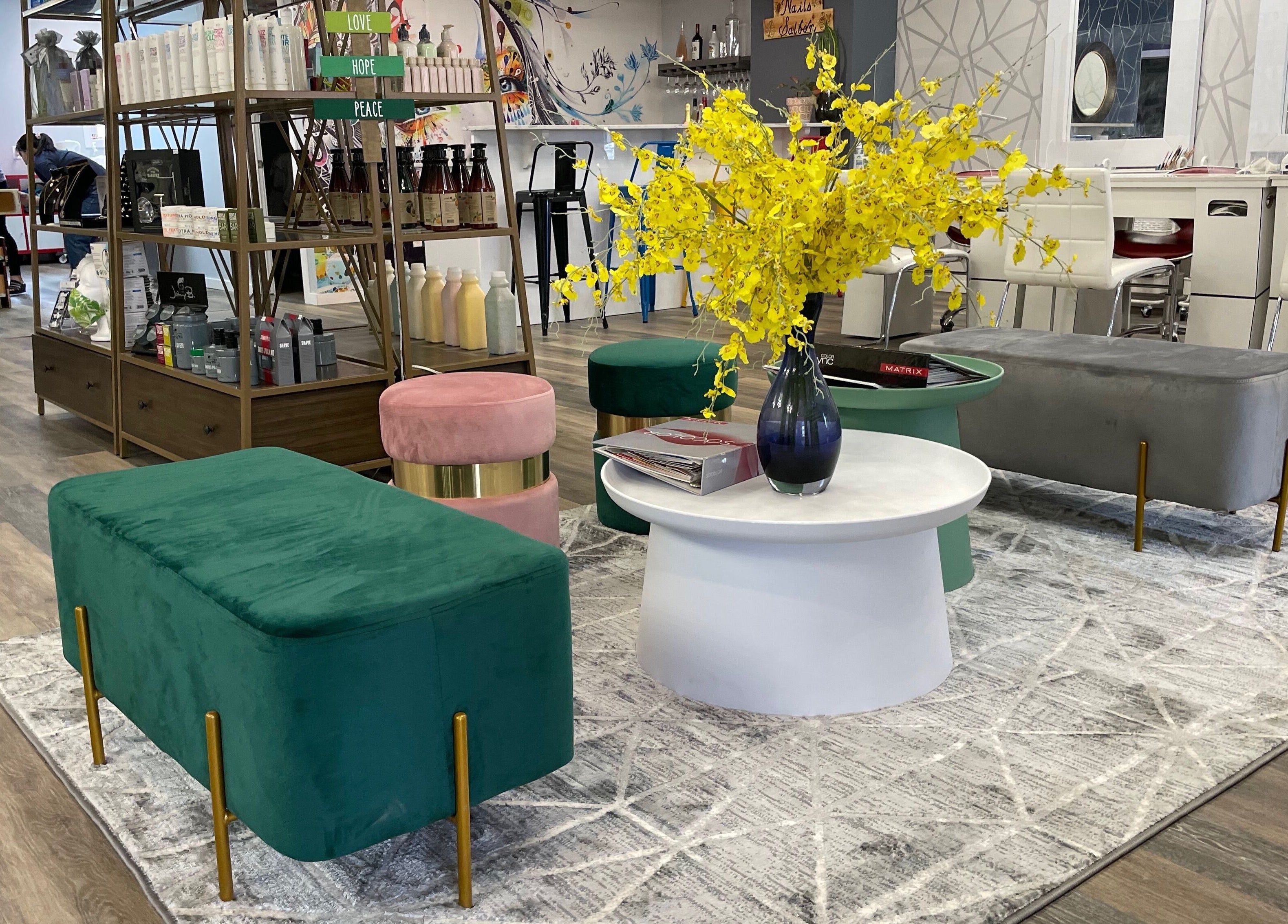 Vibrant lounge area in Friendly Nails - Fort Sask, featuring green and pink seating. Fort Saskatchewan, Alberta, CA.