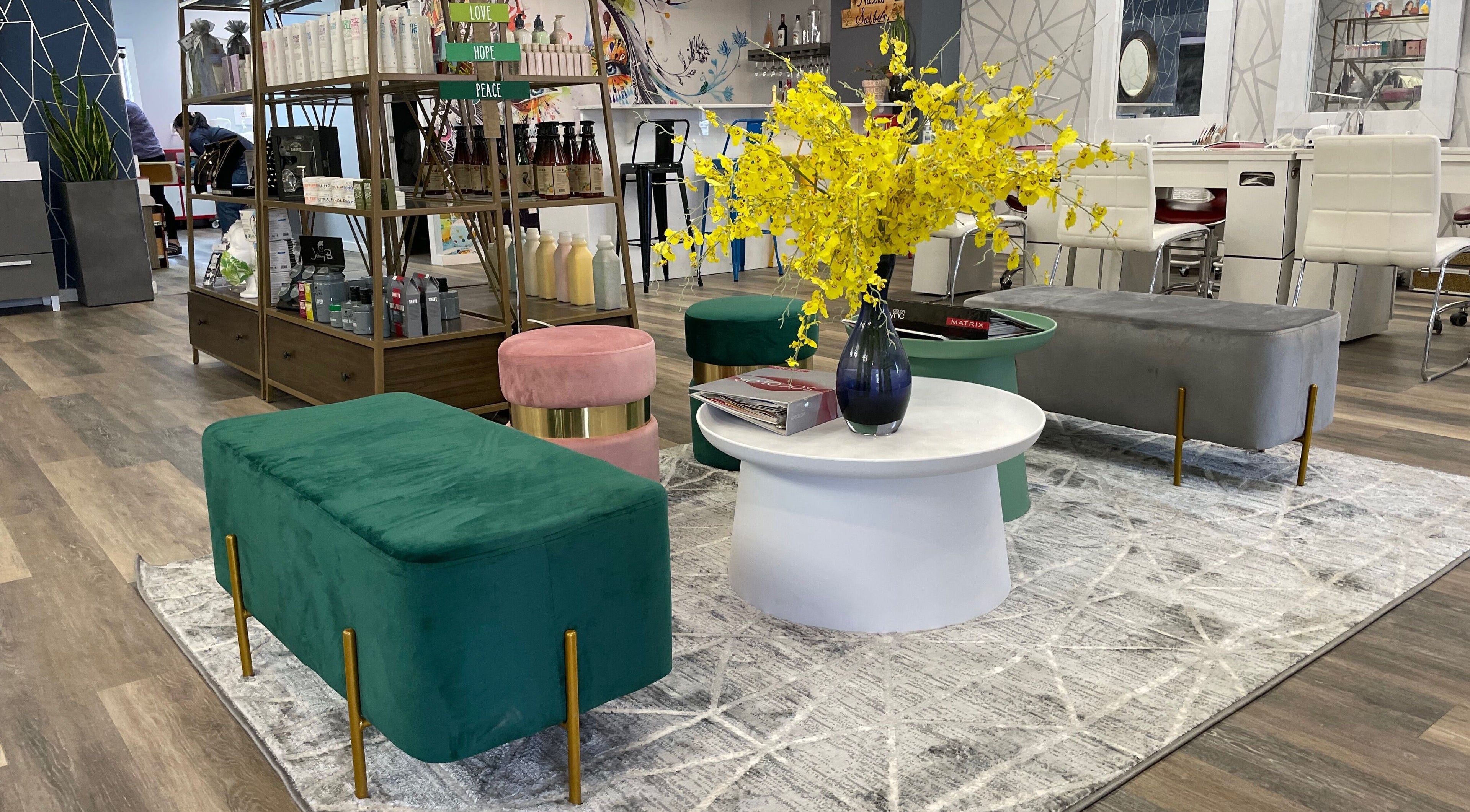 Vibrant lounge area in Friendly Nails - Fort Sask, featuring green and pink seating. Fort Saskatchewan, Alberta, CA.