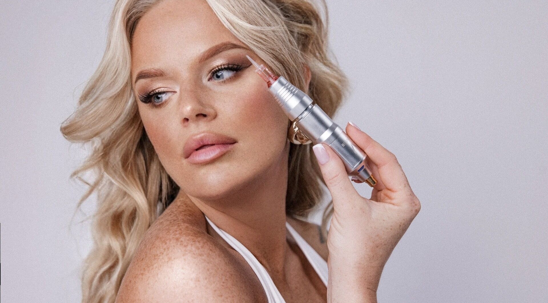 Elegant woman showcasing advanced beauty treatment at FreckledGirl Beauty Salon, Hull, England, GB.