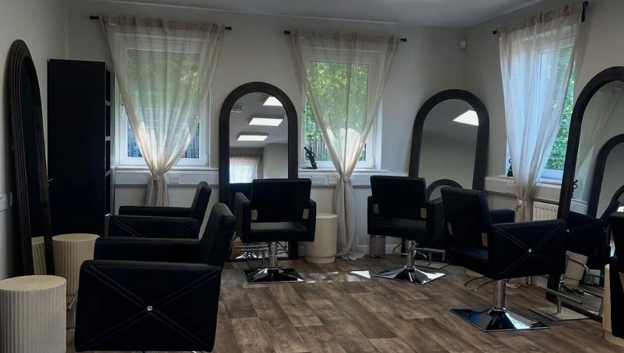 Modern salon chairs and mirrors at Hair by Zoe Fellows, Corbridge, England, GB.