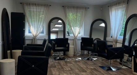Modern salon chairs and mirrors at Hair by Zoe Fellows, Corbridge, England, GB.