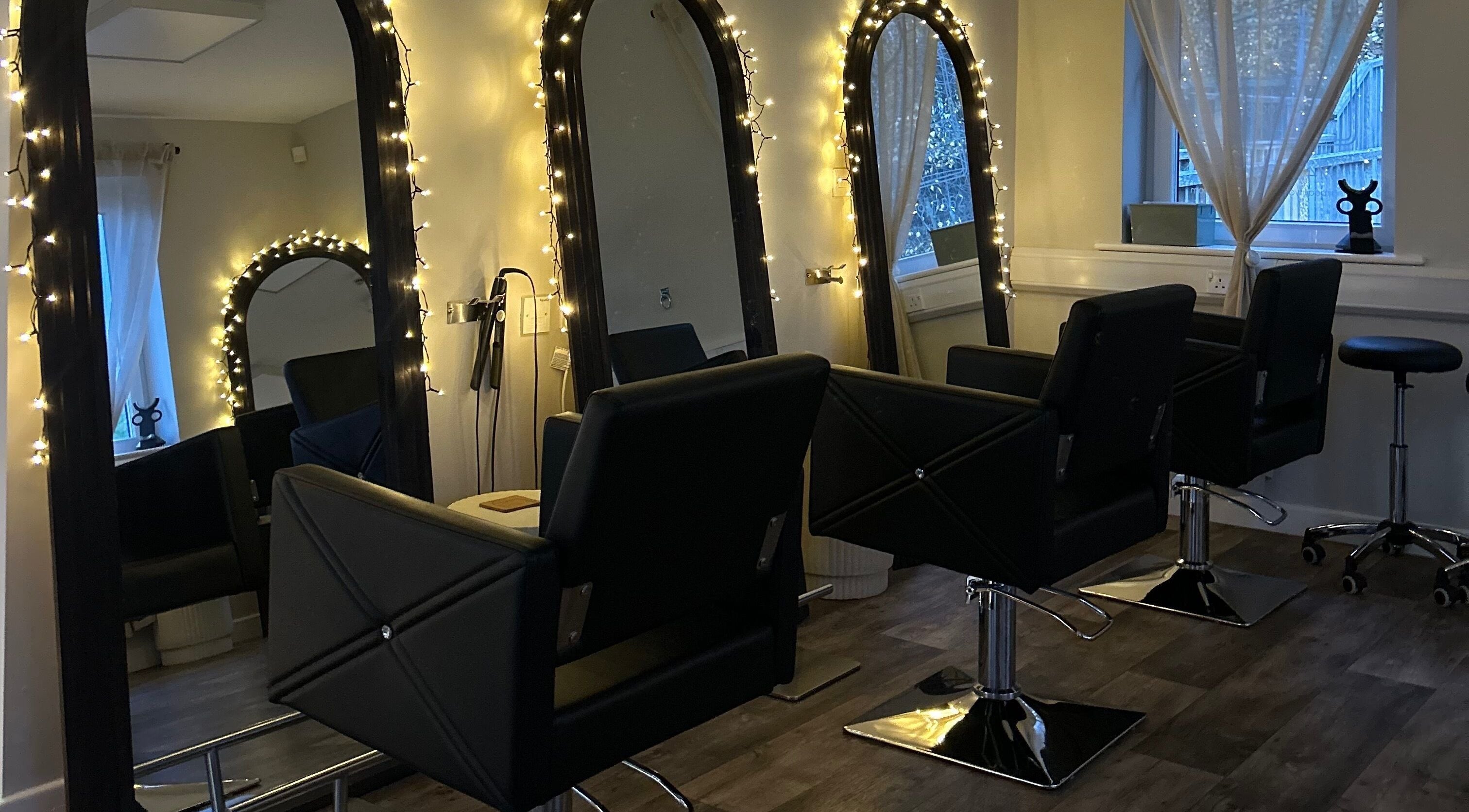 Elegant salon chairs and mirrors at Hair by Zoe Fellows, Corbridge, England, GB.