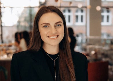 Smiling staff member at Beauty Bar by Kate, Manchester, England, GB, creating a welcoming atmosphere.