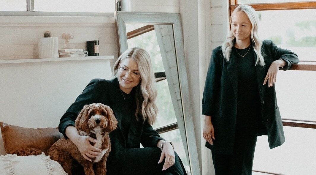 Stylish women with a dog at Cole & Co Hair Studio, Albury, New South Wales, AU, embodying a welcoming vibe.