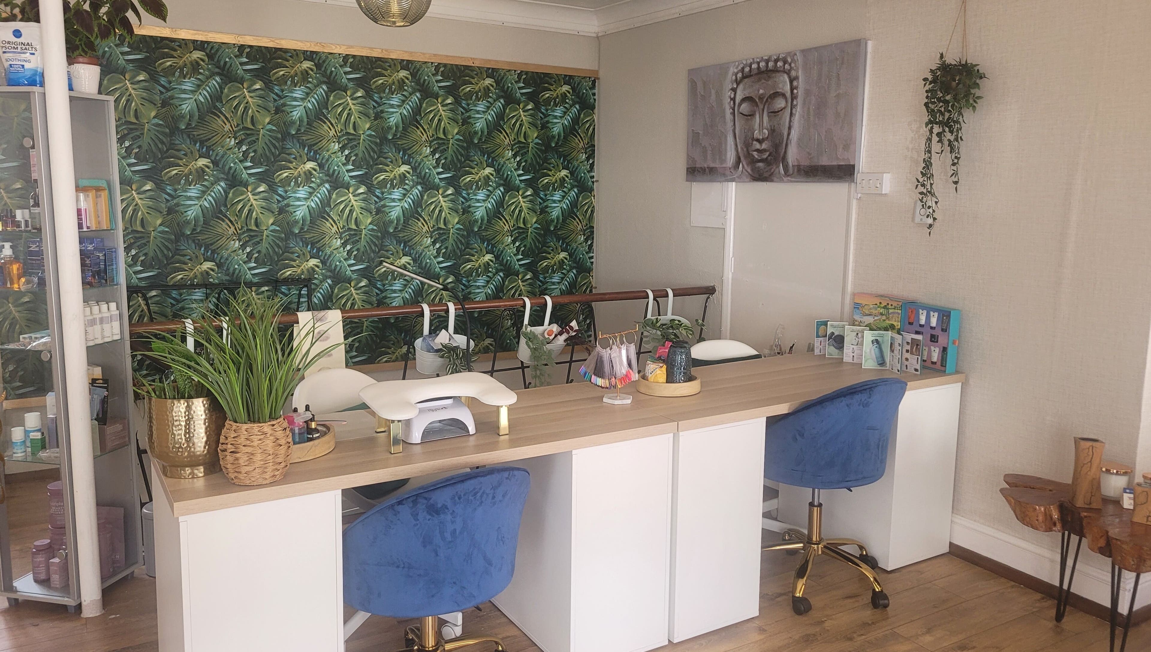 Nail station at LeBris Beauty and Wellness, Saxmundham, England, GB with tropical decor and blue chairs.