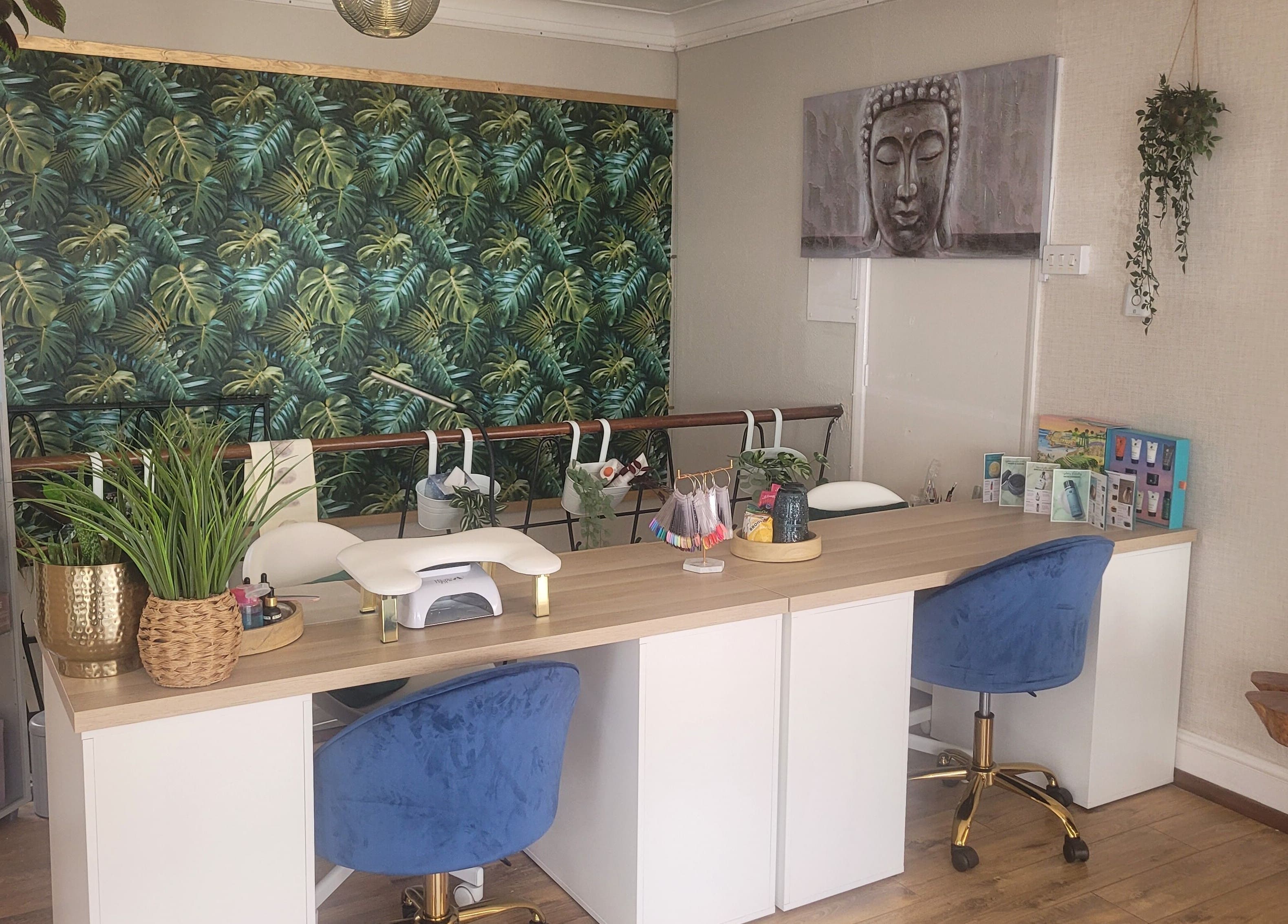 Nail station at LeBris Beauty and Wellness, Saxmundham, England, GB with tropical decor and blue chairs.