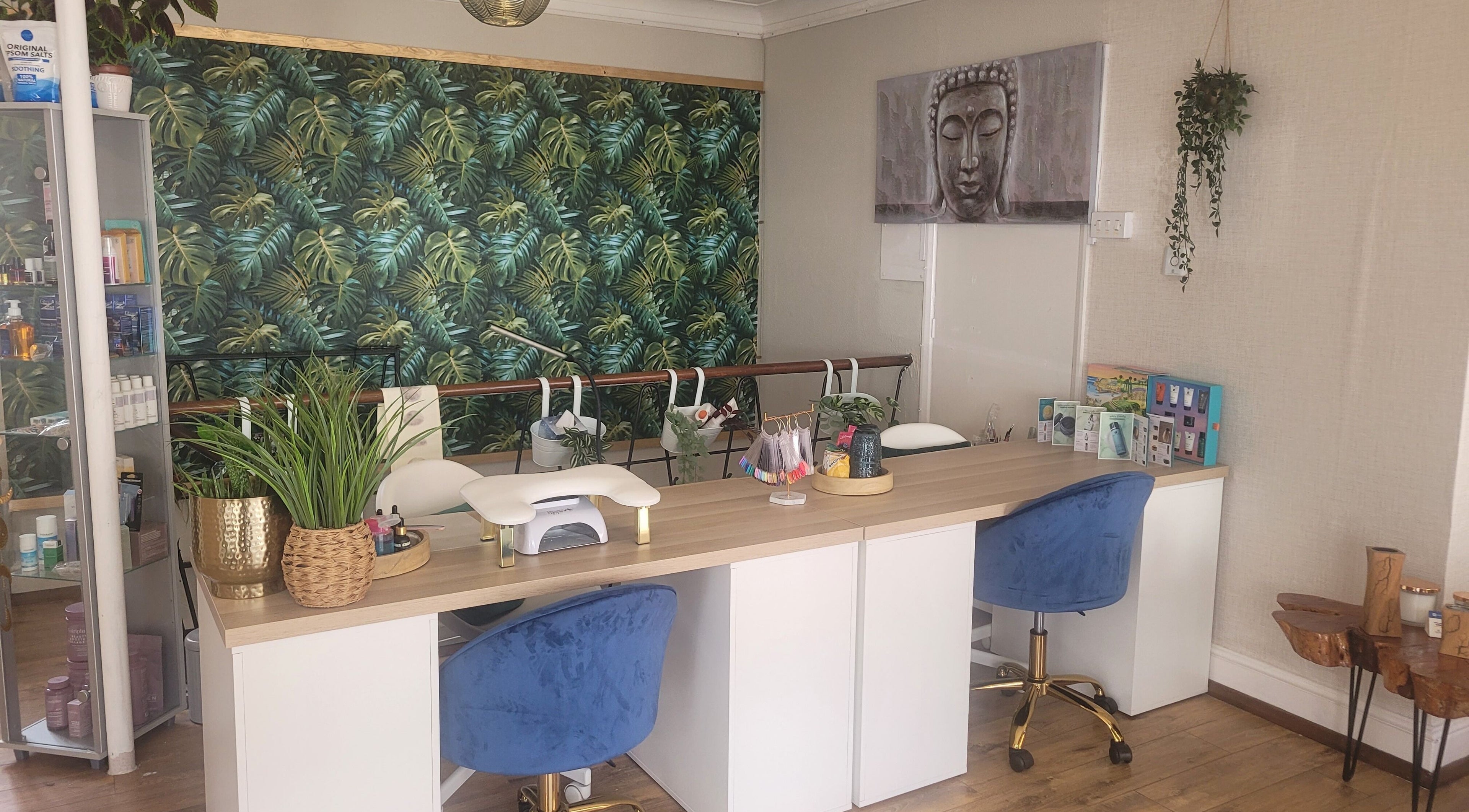 Nail station at LeBris Beauty and Wellness, Saxmundham, England, GB with tropical decor and blue chairs.