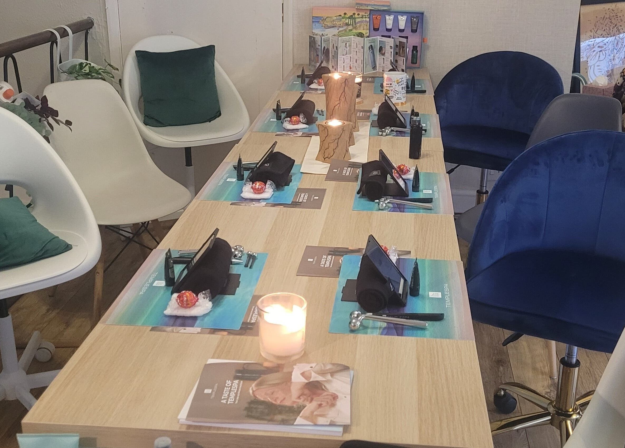 Elegant table setup with chairs at LeBris Beauty and Wellness in Saxmundham, England, GB. Candles create a warm ambience.