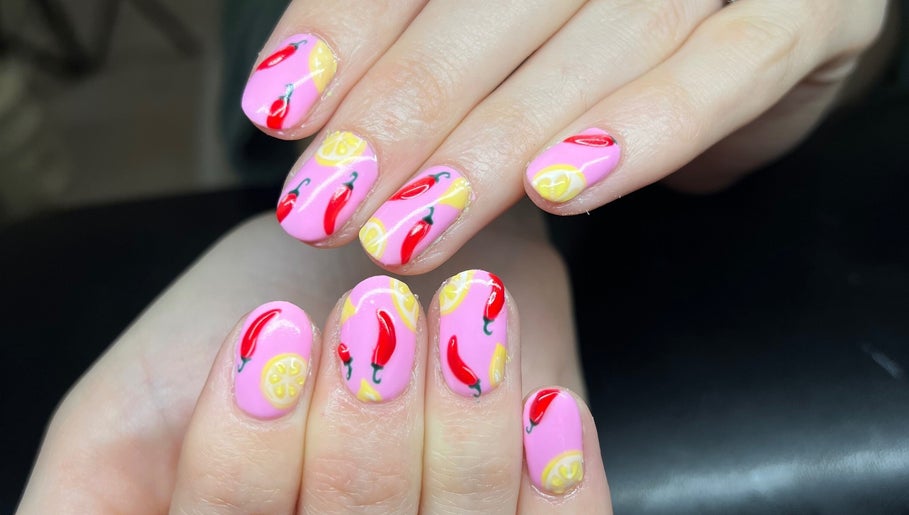 Vibrant chili and lemon nail art at Heathers Beauty, Harlow, England, GB. Stunning manicure design.