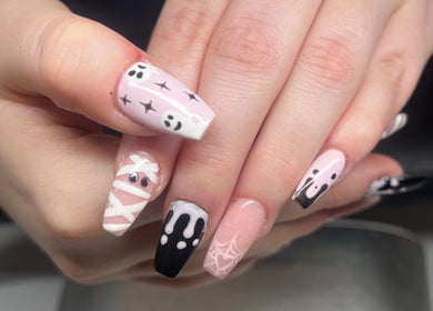Unique Halloween nail art at Heathers Beauty, Harlow, England, GB showcasing spooky yet chic designs.