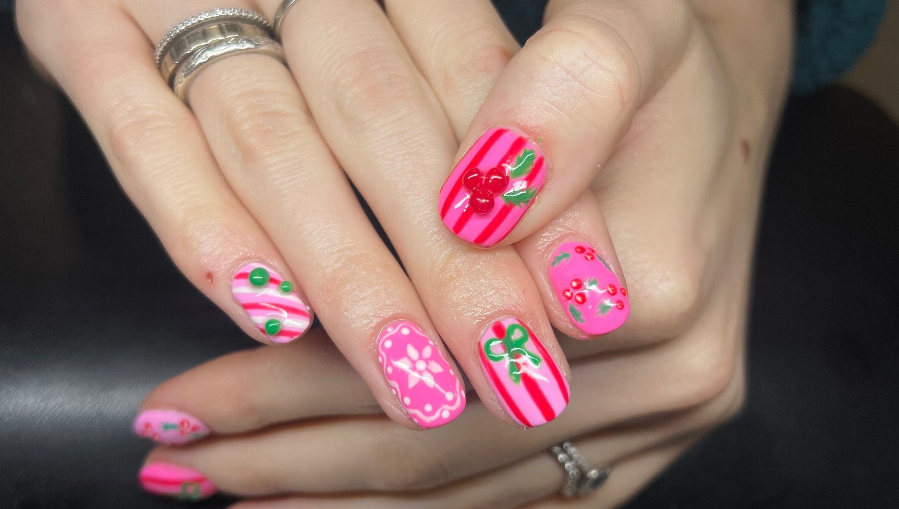 Stylish nail art with pink stripes and cherries at Heathers Beauty, Harlow, England, GB.