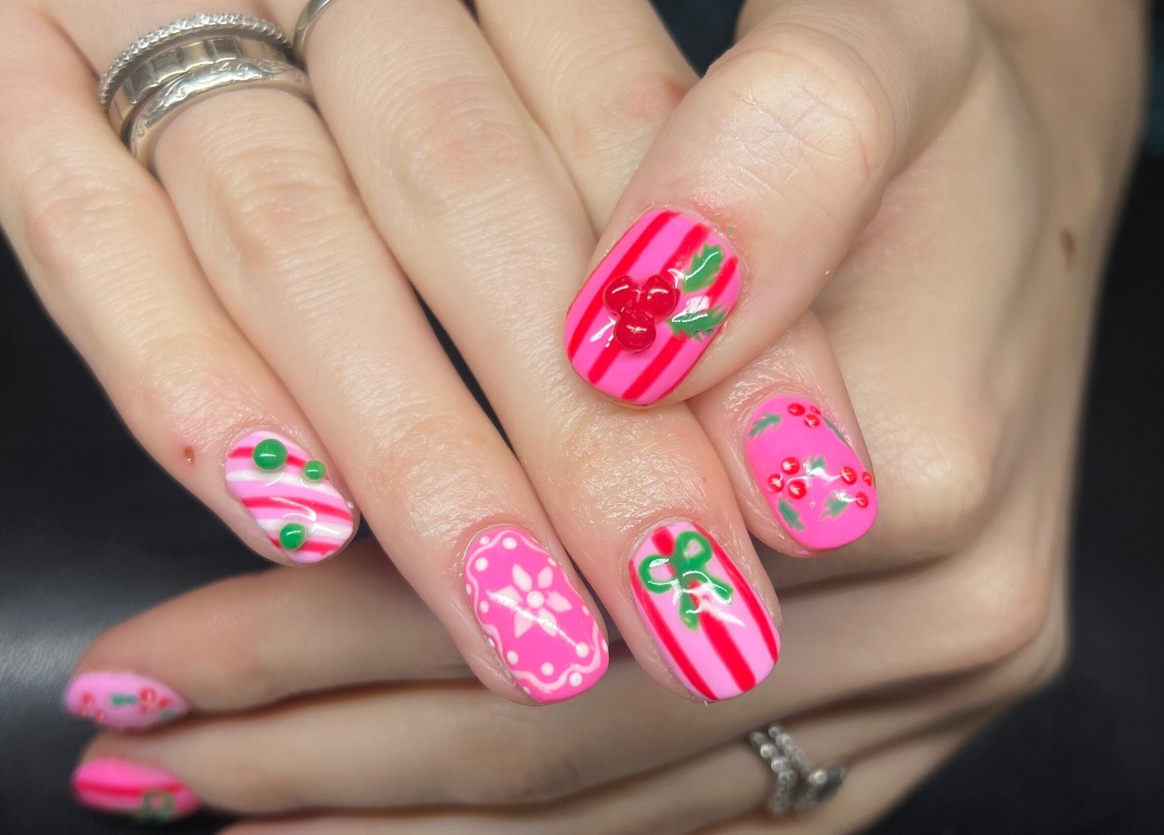 Stylish nail art with pink stripes and cherries at Heathers Beauty, Harlow, England, GB.