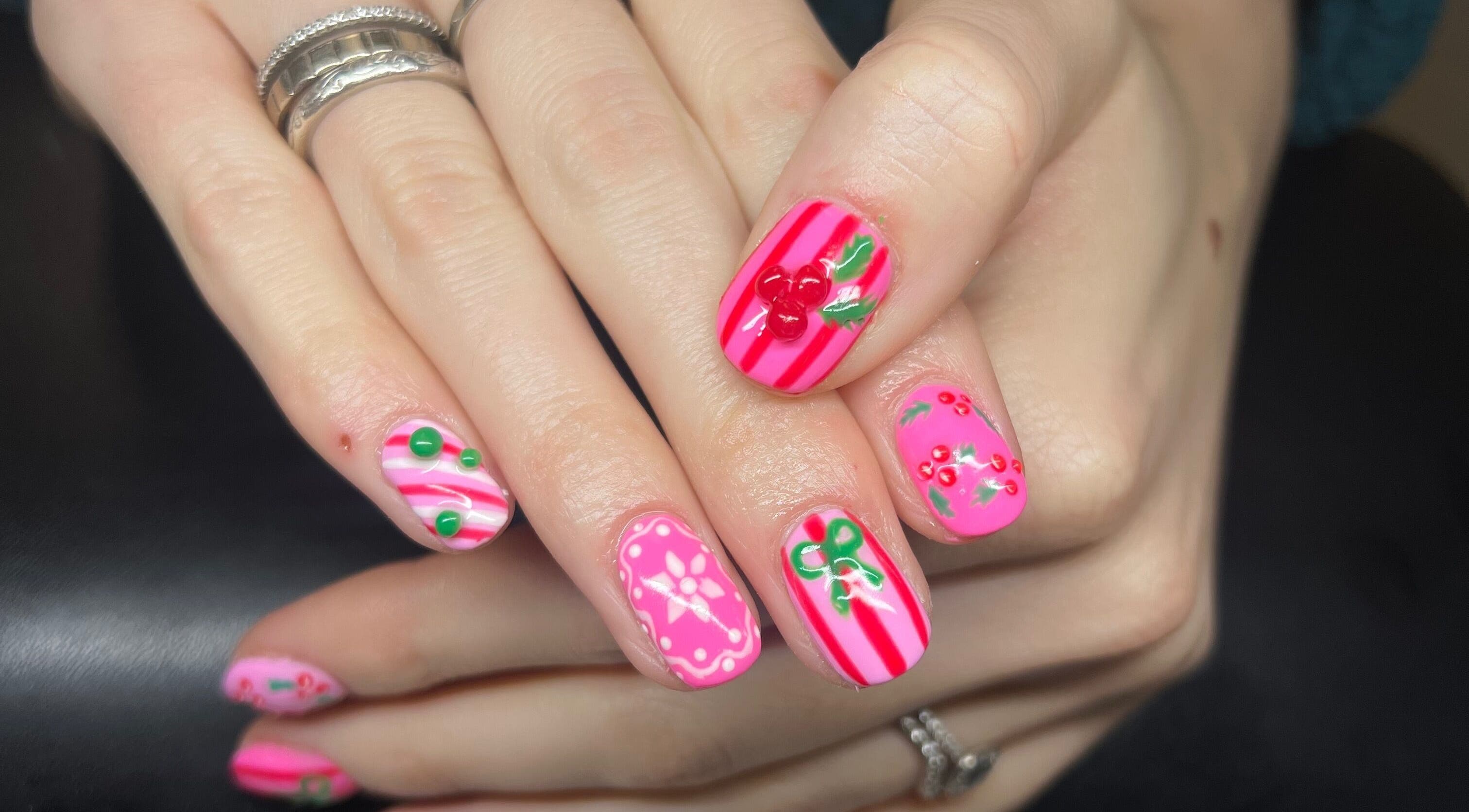 Stylish nail art with pink stripes and cherries at Heathers Beauty, Harlow, England, GB.
