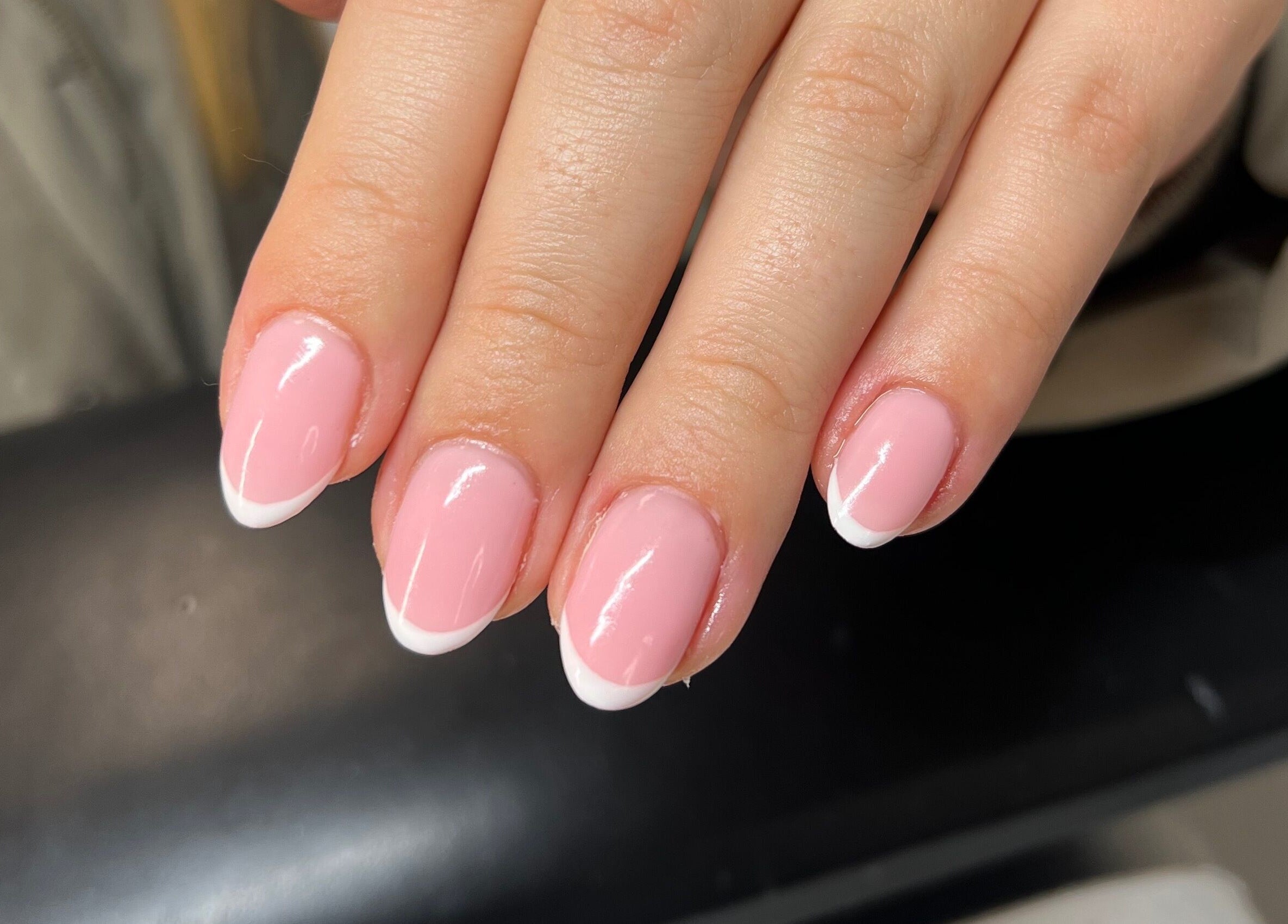 French manicure at Heathers Beauty, Harlow, England, GB showcasing glossy pink nails with white tips.