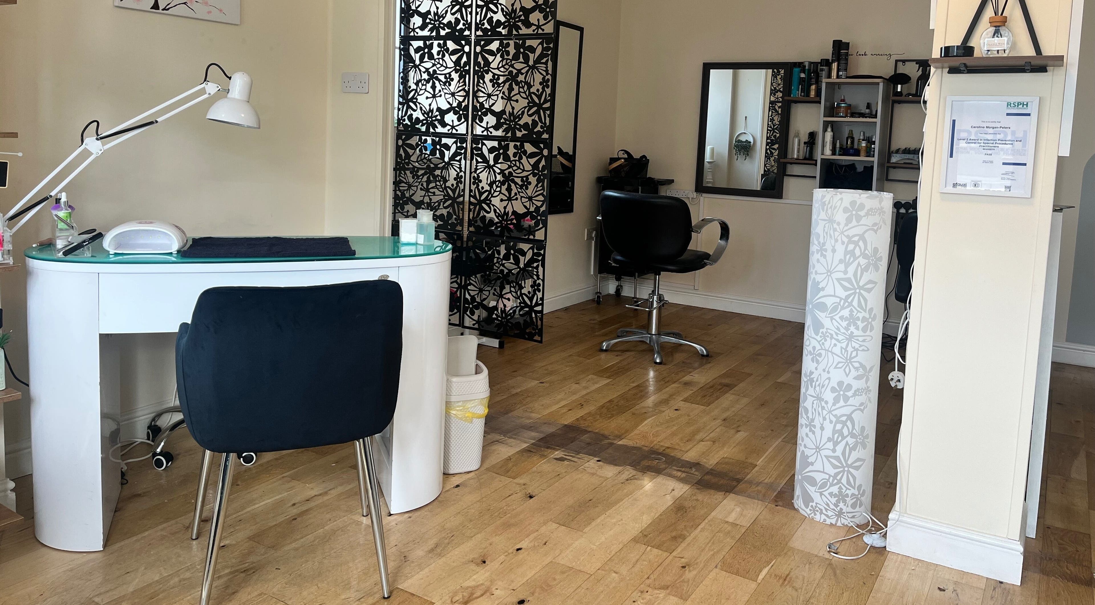 Elegant salon interior at Absolute Salon, Valley, Wales, GB—modern design with a spacious, inviting atmosphere.