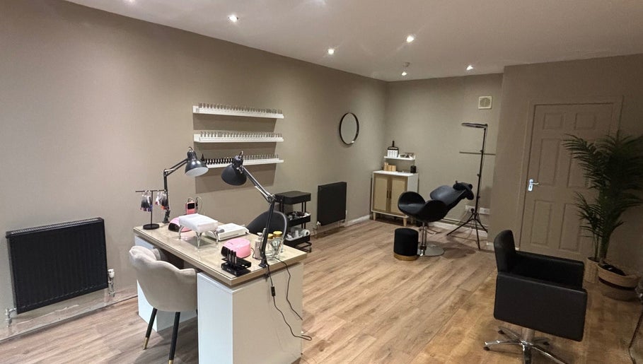 Cloud studio's elegant treatment room in Livingston, Scotland, GB showcasing comfy chairs and modern decor.