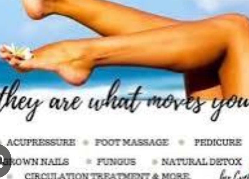 Relaxed legs with flower by the sea at Boom by Sophie - The Spa, Philipsburg, SX. Experience pure tranquility.