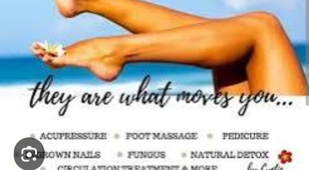 Relaxed legs with flower by the sea at Boom by Sophie - The Spa, Philipsburg, SX. Experience pure tranquility.