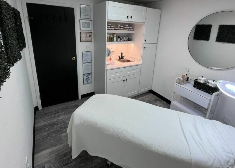 Cozy treatment room at Anda Organic Boutique Spa, West Islip, New York, US with a plush bed and calming decor.