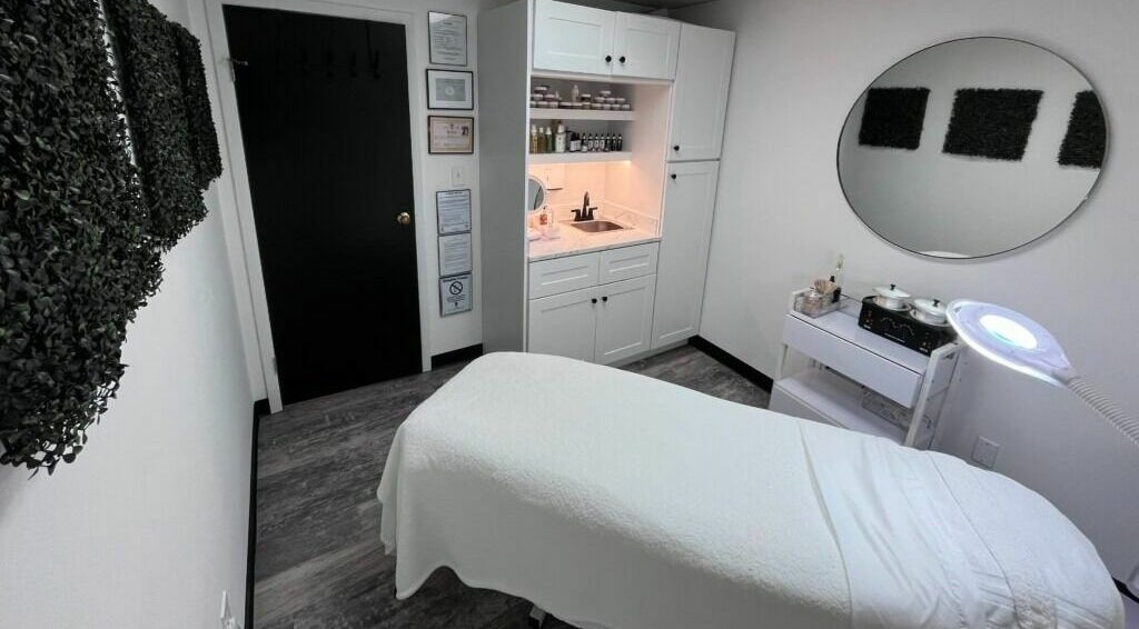 Cozy treatment room at Anda Organic Boutique Spa, West Islip, New York, US with a plush bed and calming decor.