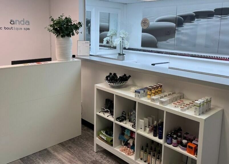 Reception area at Anda Organic Boutique Spa, West Islip, New York. Modern decor with product display.