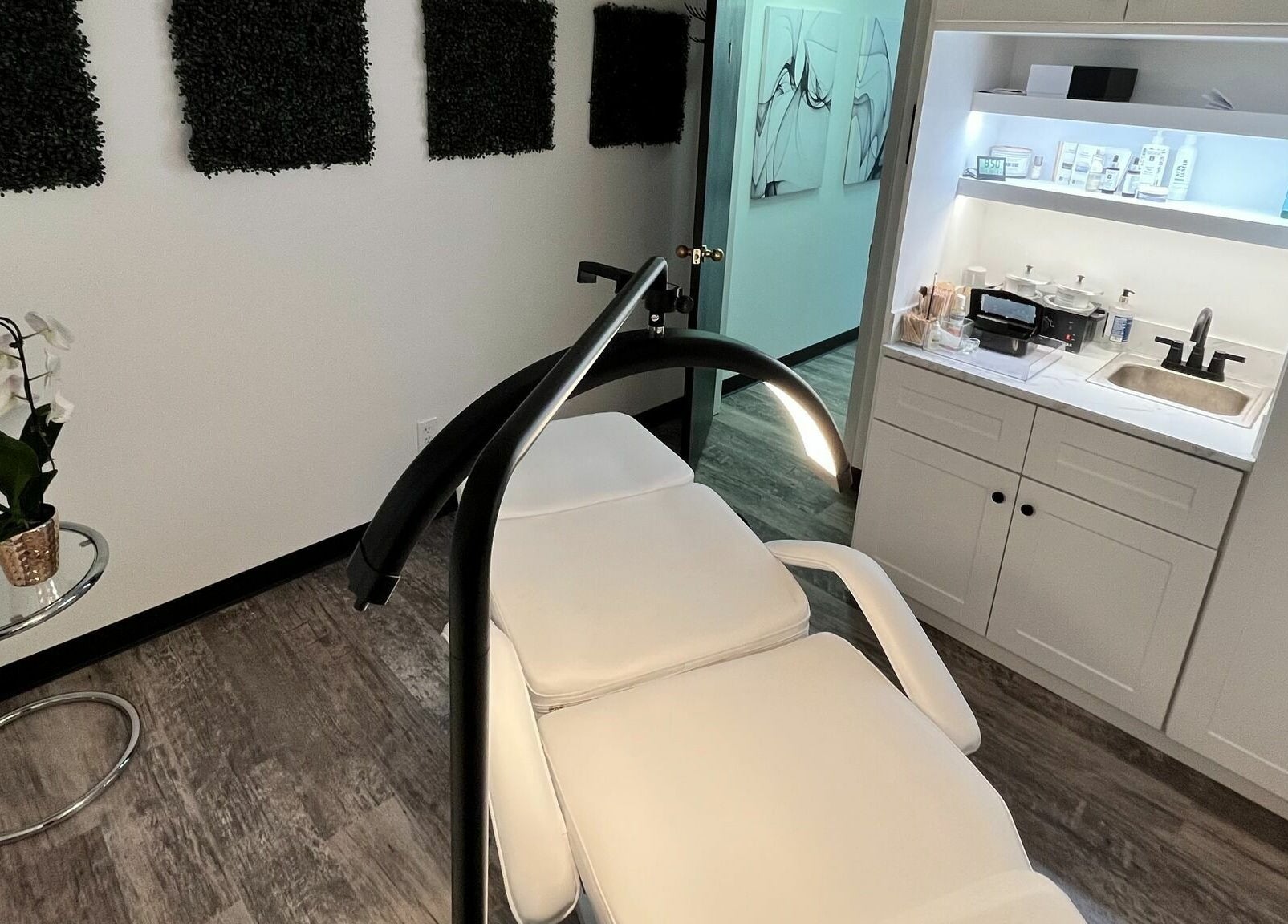 Elegant treatment room at Anda Organic Boutique Spa, West Islip, New York, US featuring a plush chair and modern design.