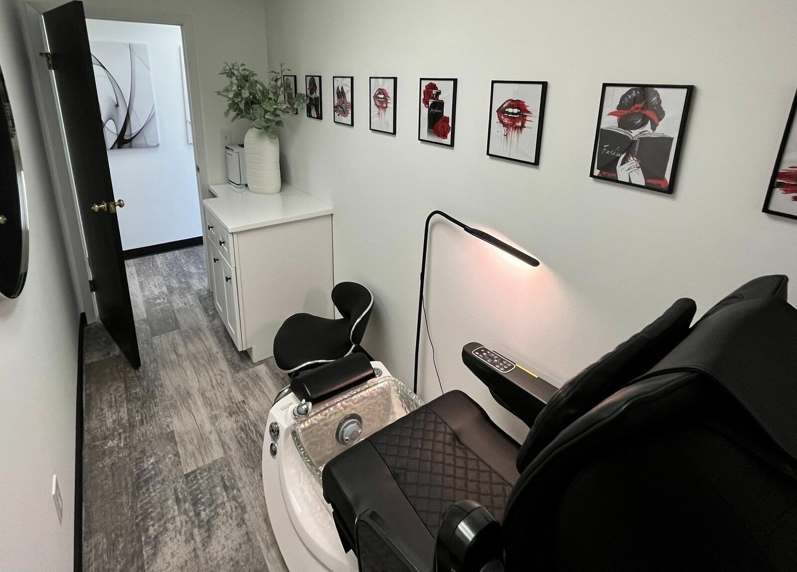 Chic pedicure room at Anda Organic Boutique Spa, West Islip, New York, US. Modern decor, stylish black chair.