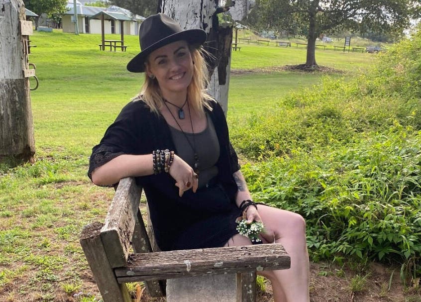 Woman sitting on a bench at Cobi-Jane Intuitive Connections in Belmont North, New South Wales, AU.