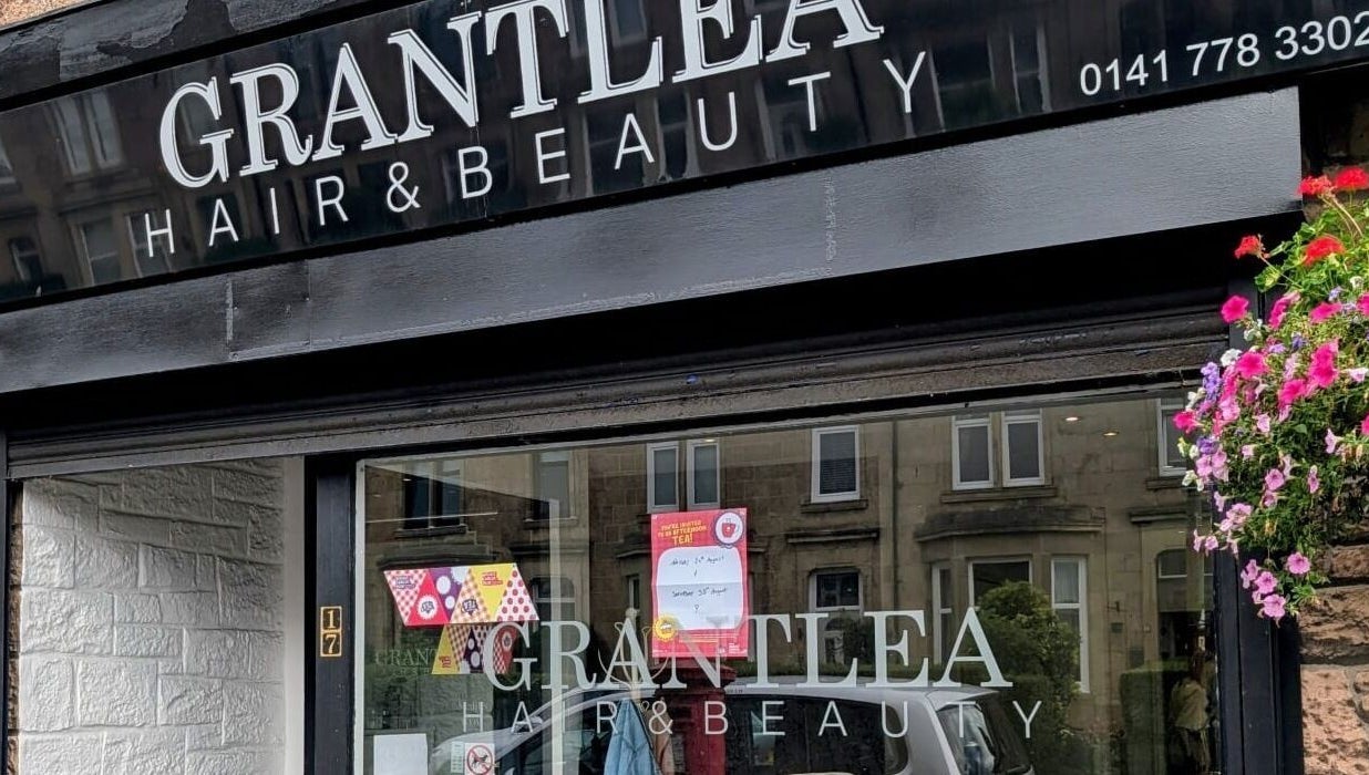 Front view of Grantlea Hair & Beauty near Cwl Collective, Glasgow, Scotland, GB with floral decor.