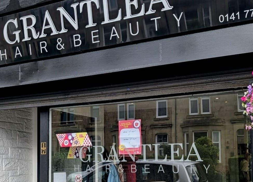 Front view of Grantlea Hair & Beauty near Cwl Collective, Glasgow, Scotland, GB with floral decor.
