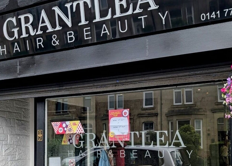 Front view of Grantlea Hair & Beauty near Cwl Collective, Glasgow, Scotland, GB with floral decor.