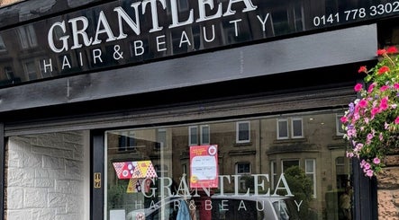 Front view of Grantlea Hair & Beauty near Cwl Collective, Glasgow, Scotland, GB with floral decor.