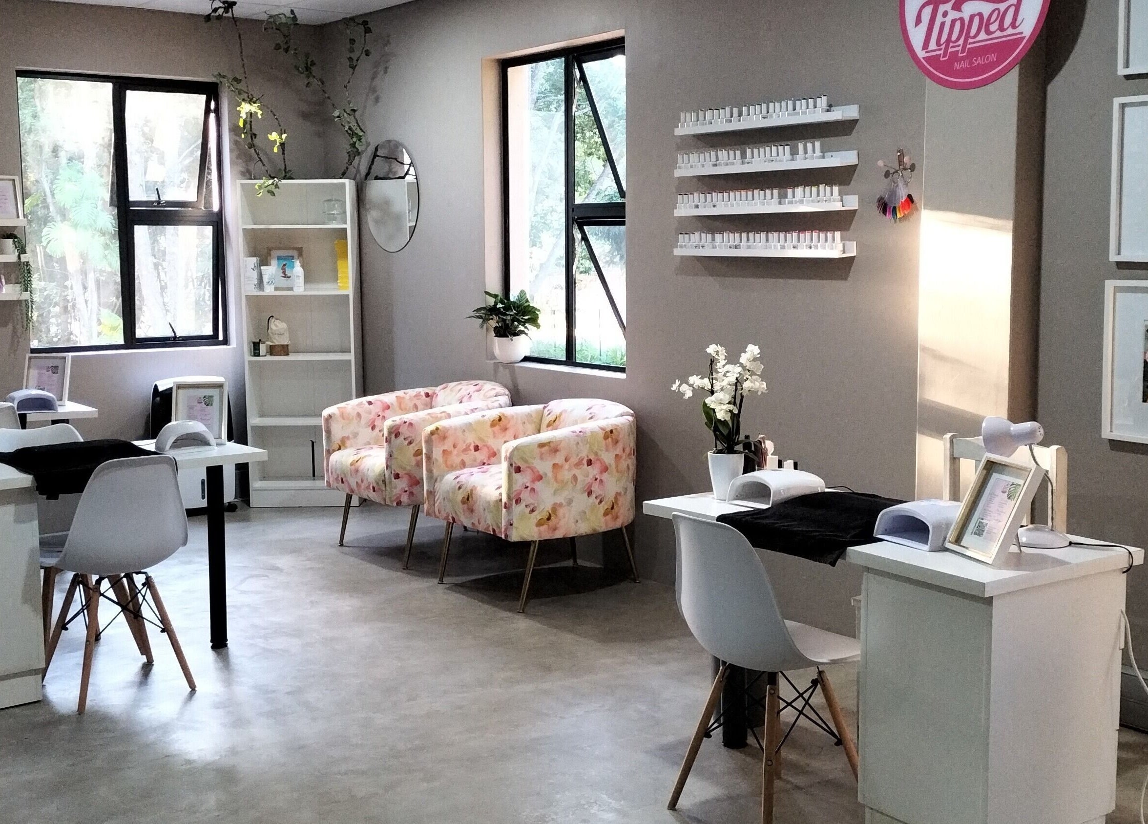 Elegant nail salon interior at Simply Tipped in Gillitts, Kwazulu-natal, ZA, featuring stylish decor.