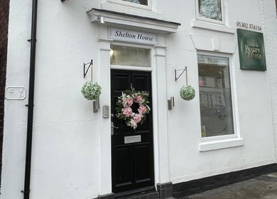 Charming exterior of Scorpio Nails & Beauty in Doncaster, England, GB with floral decor and signage.