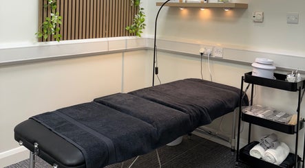 Serene treatment room at Scorpio Nails & Beauty, Doncaster, England, GB featuring a black massage bed.