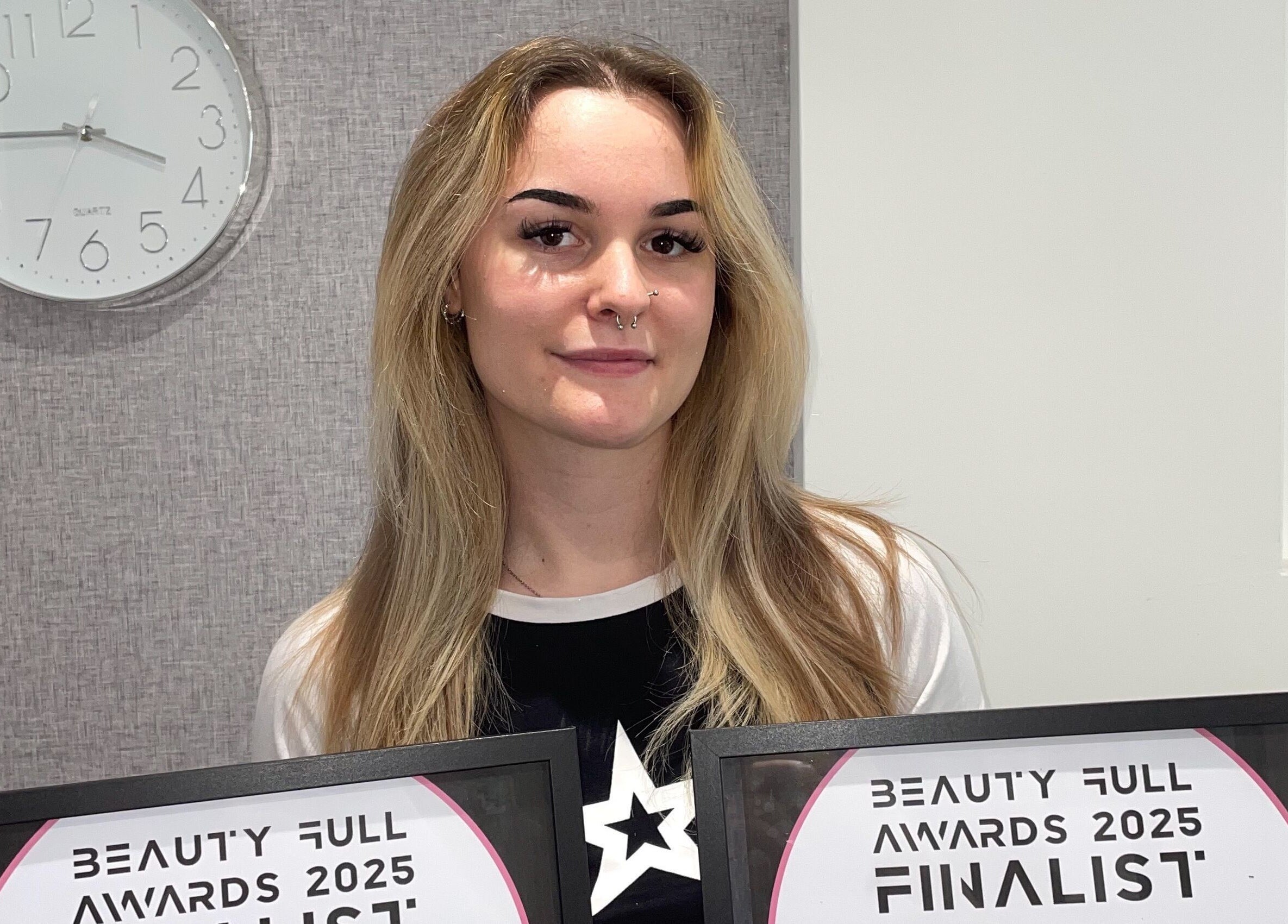 Award finalist holding certificate at Scorpio Nails & Beauty, Doncaster, England, GB.