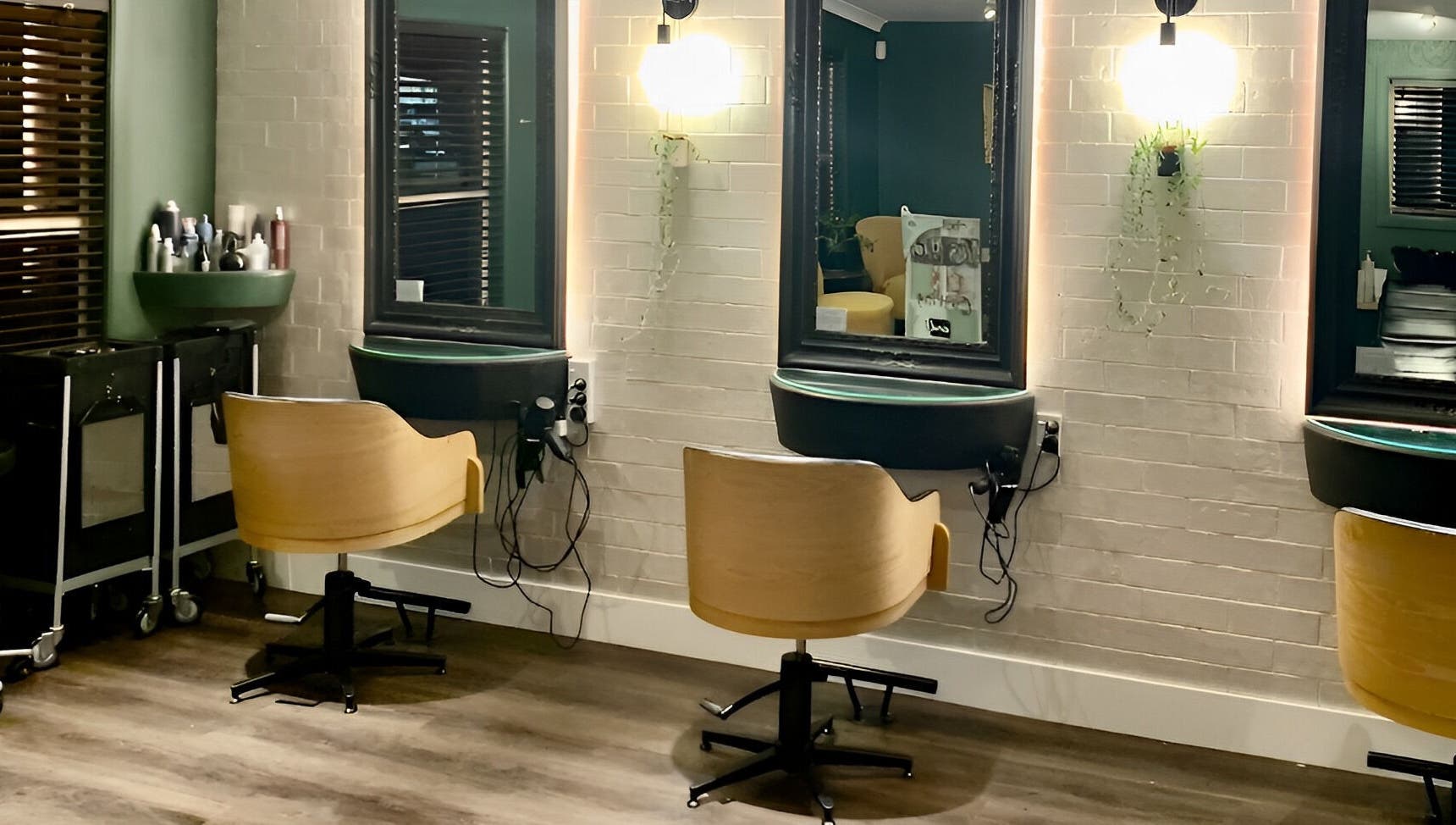 Stylish seating area at Tonic Hairdressing, Raglan, Waikato, NZ showcasing modern salon decor.