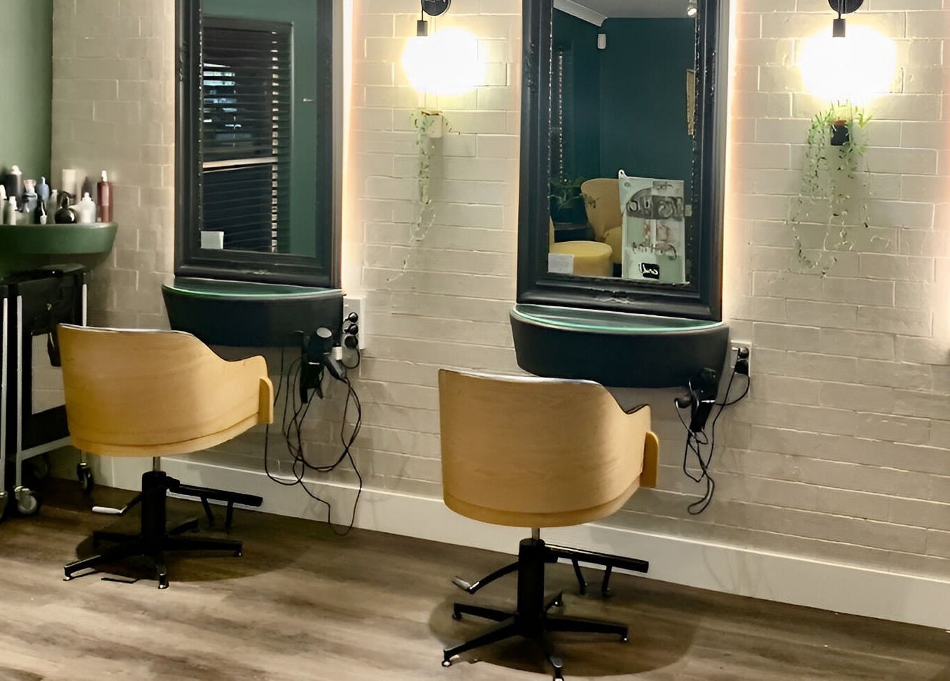 Stylish seating area at Tonic Hairdressing, Raglan, Waikato, NZ showcasing modern salon decor.