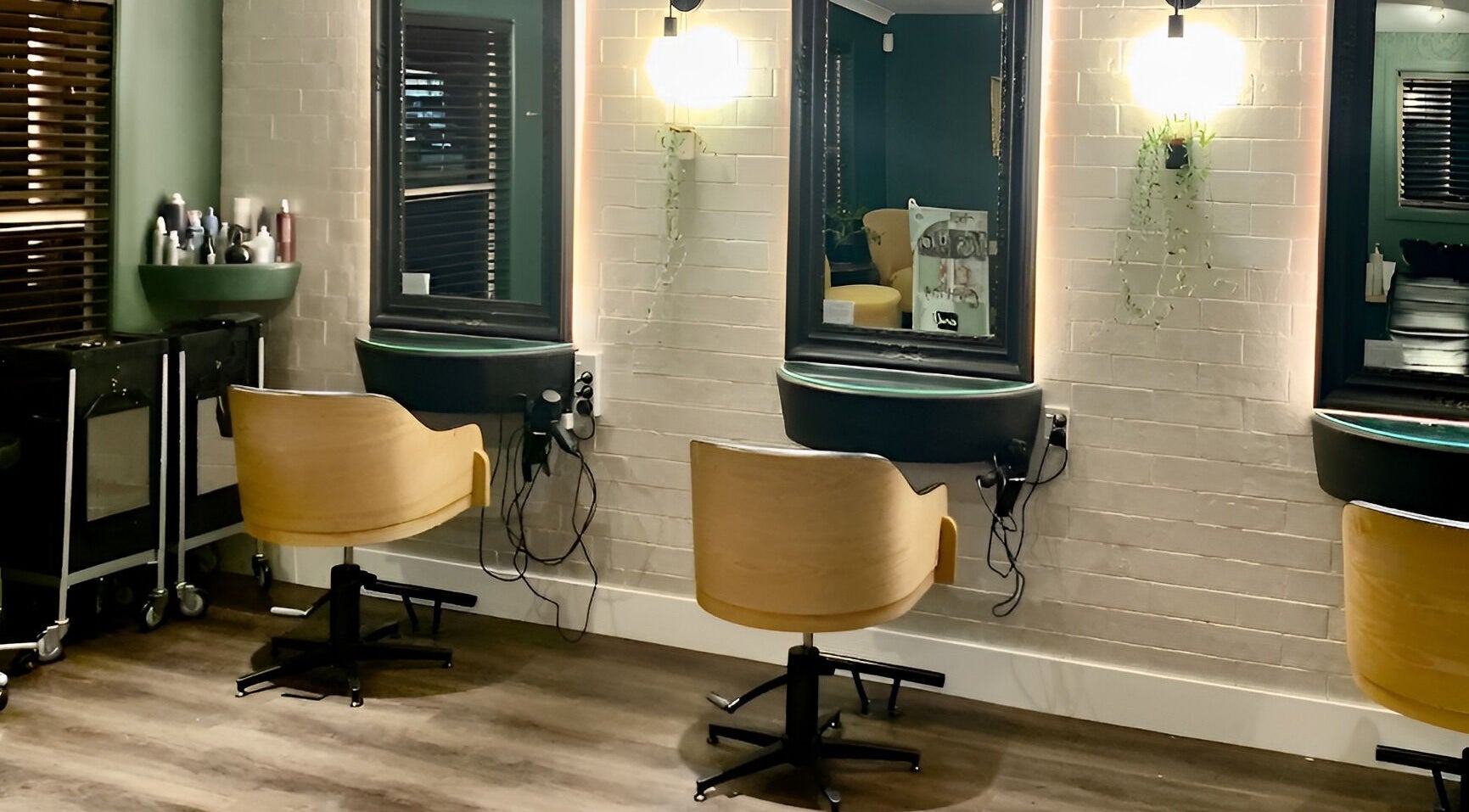 Stylish seating area at Tonic Hairdressing, Raglan, Waikato, NZ showcasing modern salon decor.