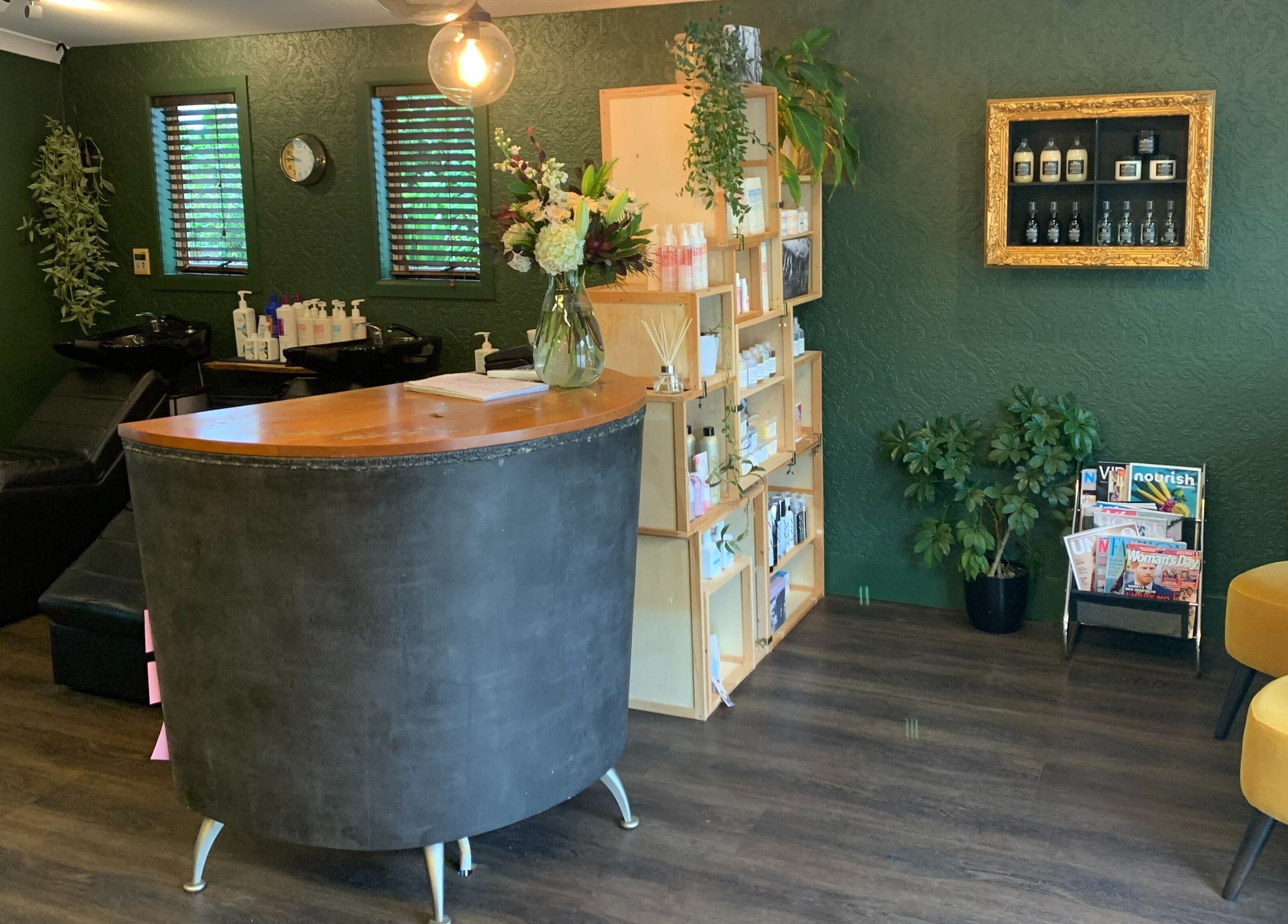 Elegant interior of Tonic Hairdressing in Raglan, Waikato, NZ with modern decor and products on display.