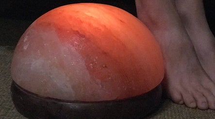 Warm Himalayan salt lamp at Green Room Remedies, Get Me Some Green, Matthews, NC, US provides soothing ambiance.