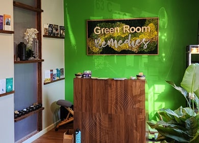 Reception area of Green Room Remedies at Get Me Some Green, Matthews, North Carolina, US with green walls and decor.