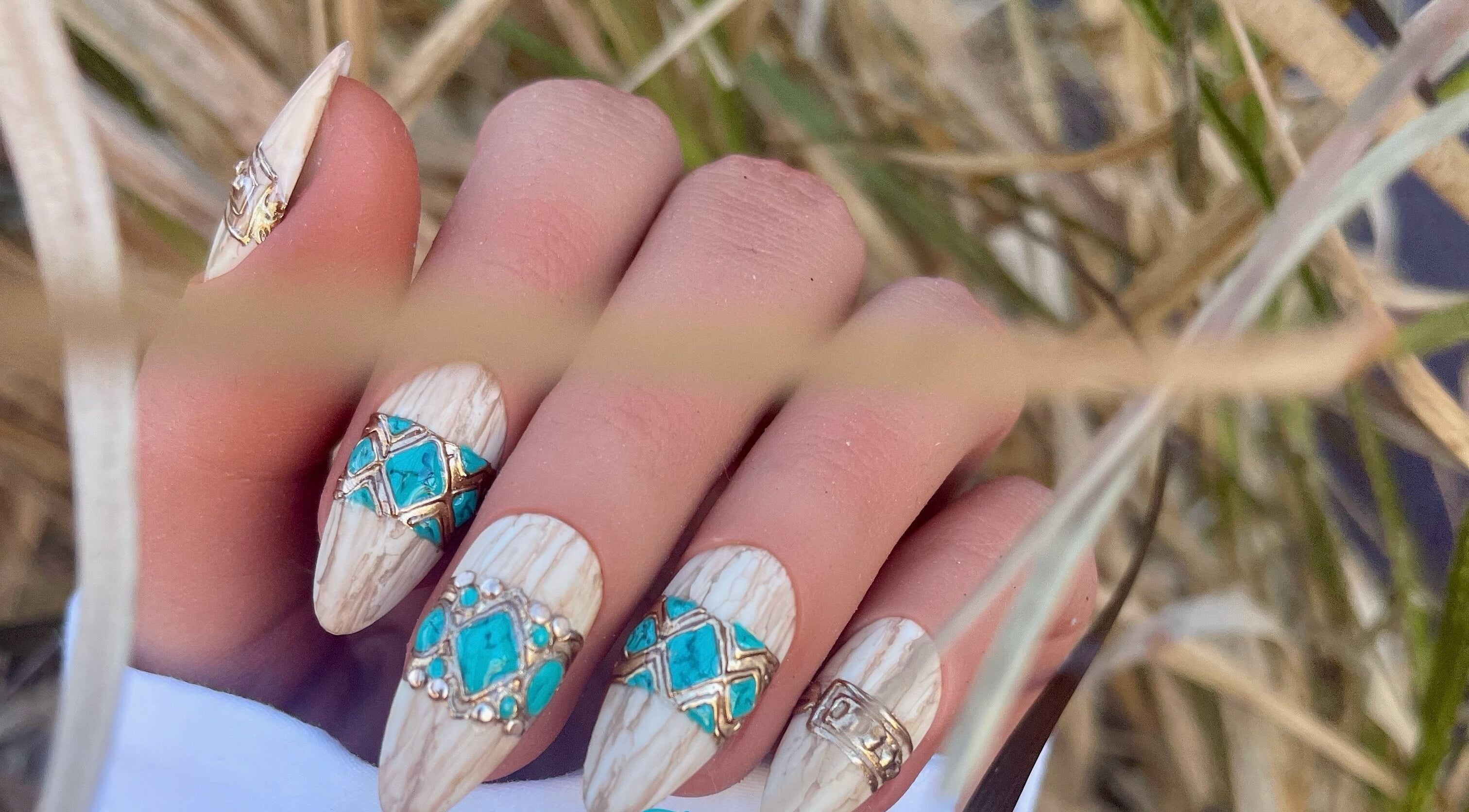 Elegant nail art with intricate blue designs at Beauty Fennique, Carindale, Queensland, AU.