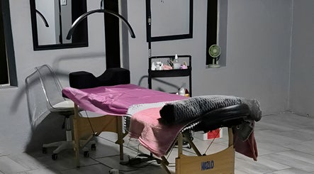 Interior of Dramatyes Lash Lounge in Springs, Gauteng, ZA, showcasing a comfortable treatment bed and modern decor.